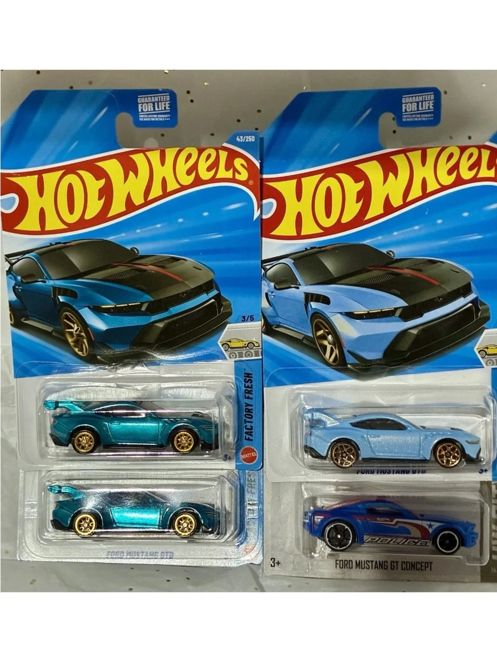2 Super Treasure Hunt GTD Mustangs (1 peg holder slightly bent) and 2  regular